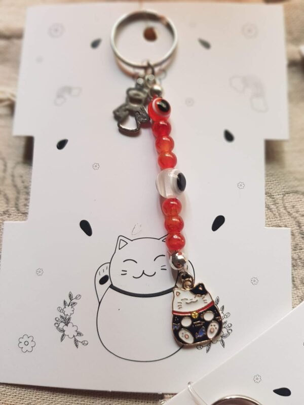 Llaveros Neko dije Metal , 7chakras y ojo turco