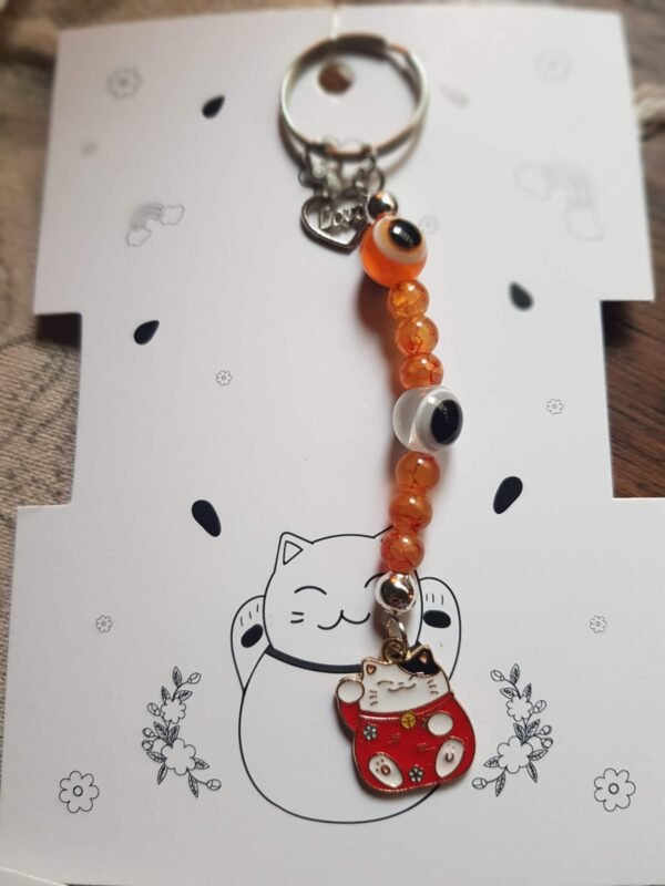 Llaveros Neko dije Metal , 7chakras y ojo turco