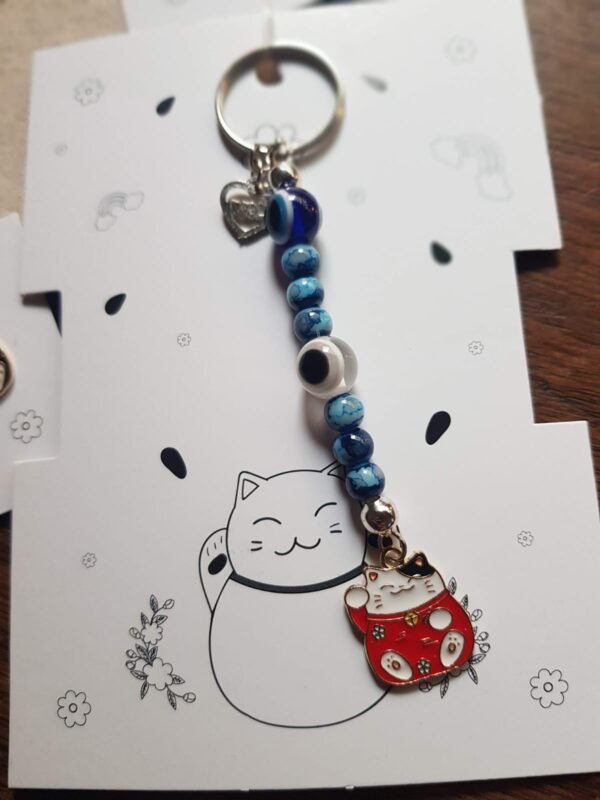 Llaveros Neko dije Metal , 7chakras y ojo turco
